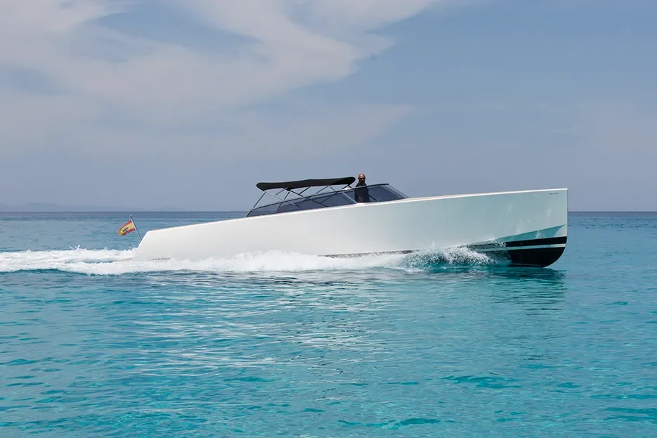 VanDutch 40 moving steadily along the coast with low profile design and shaded cockpit
