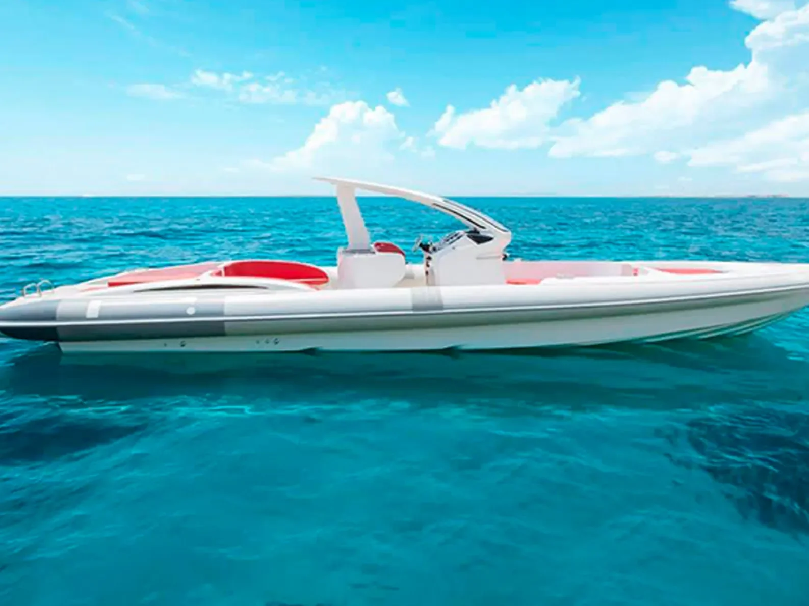 Side profile of the Pirelli 1400 cruising calmly over turquoise water in Ibiza