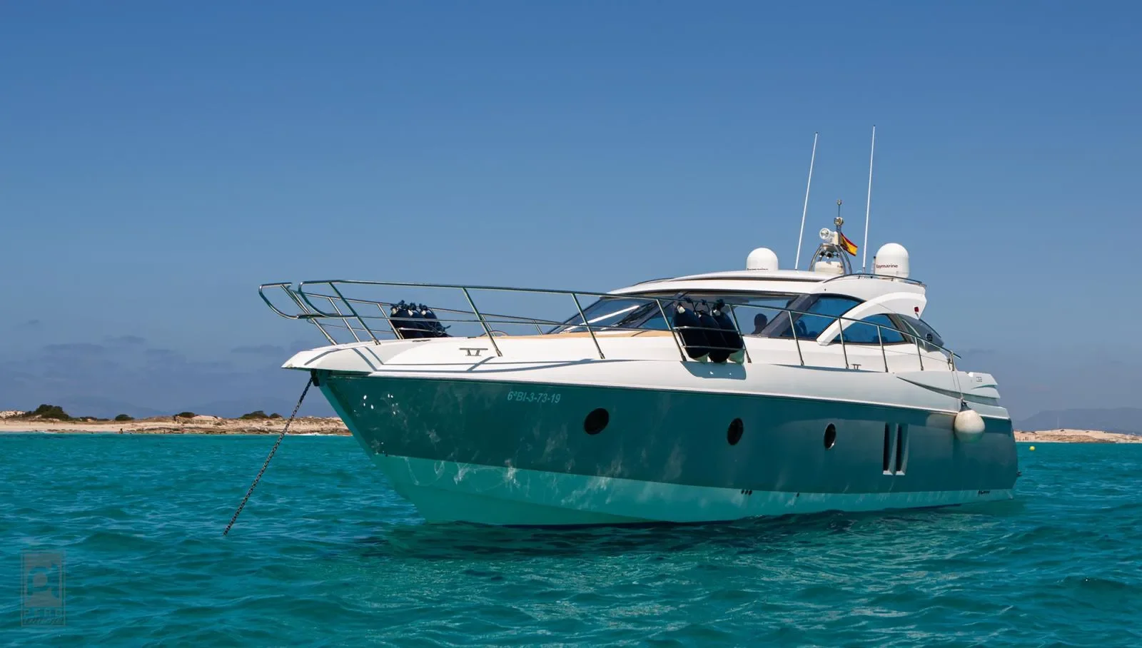 Sessa Marine 52 side profile at anchor showing the elegant hull lines and bow area