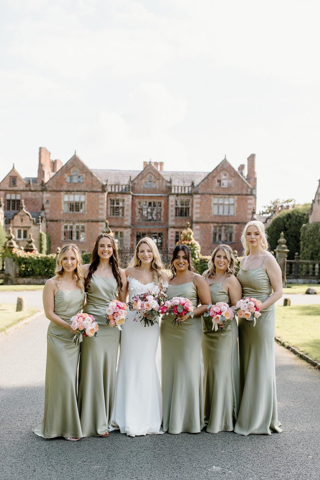 Bride and Bridesmaids pose in front of Dorfold Hall.