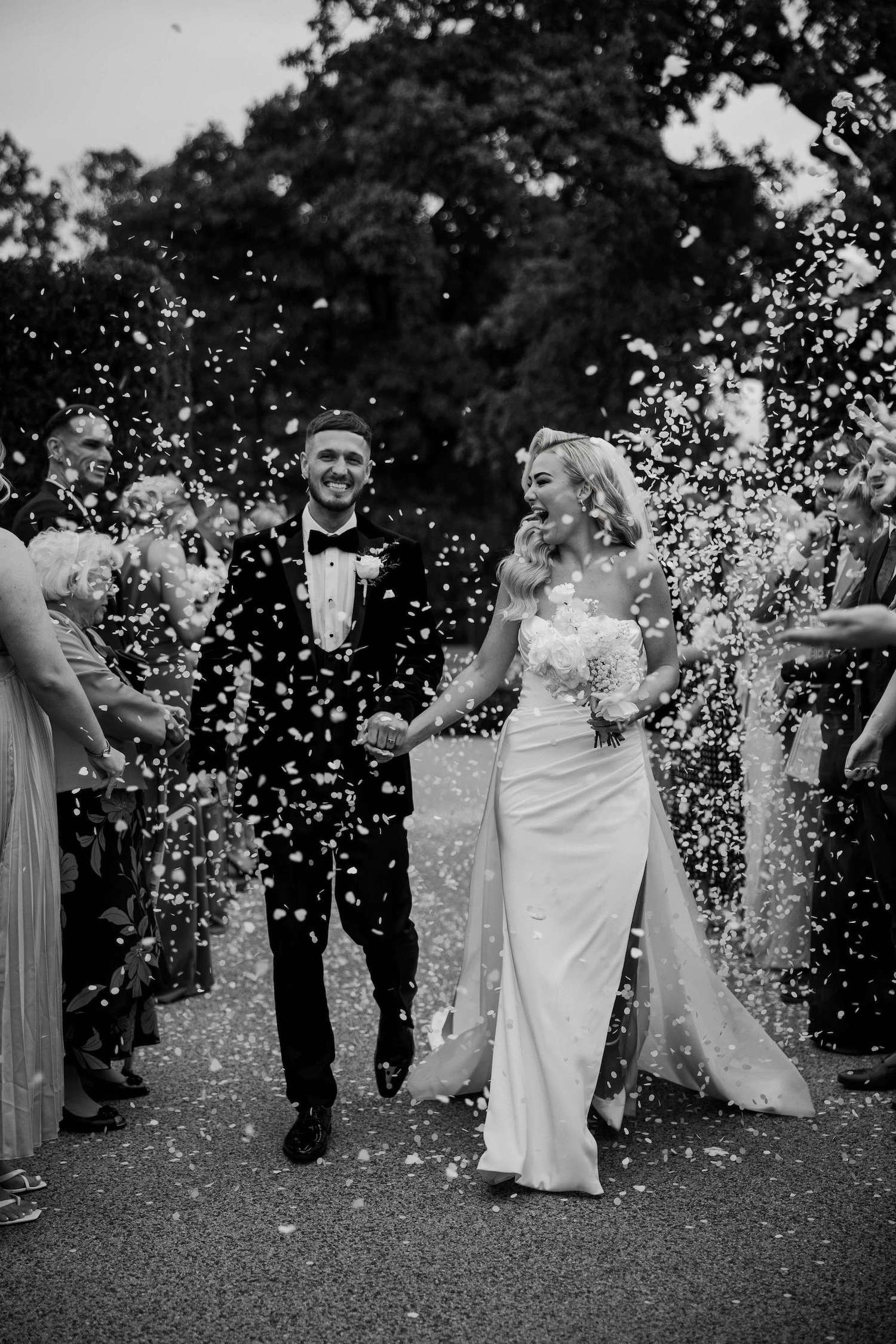 Bride and Groom pose for confetti Photograph.