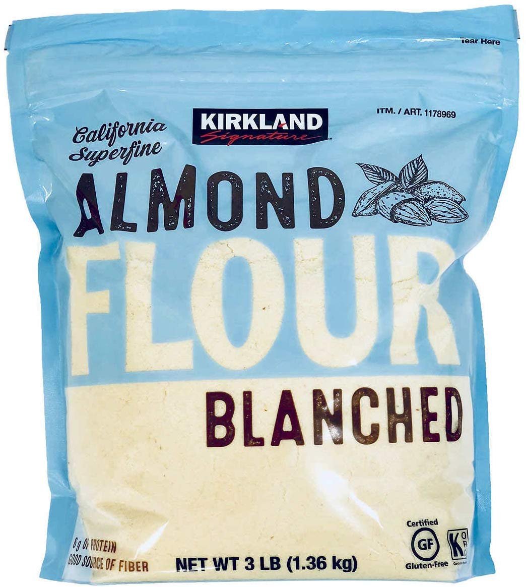 Kirkland Signature almond flour package, 3 lb, blue bag, gluten-free, blanched, California superfine, with nutrition info.