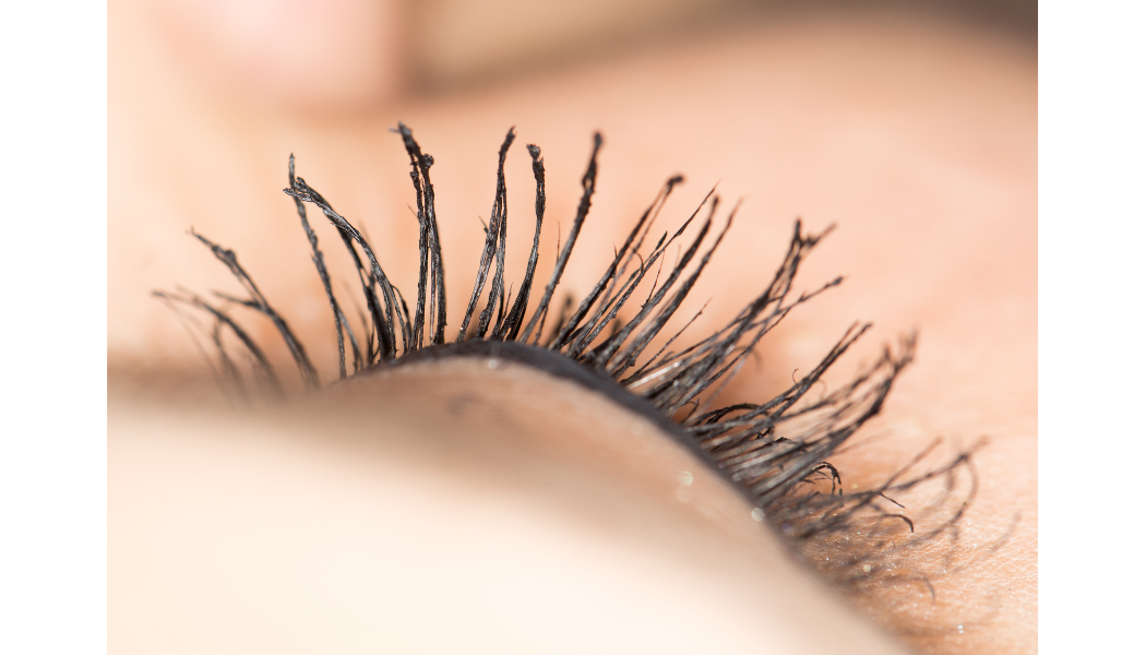 Close-up of a build up of mascara in eyelashes.