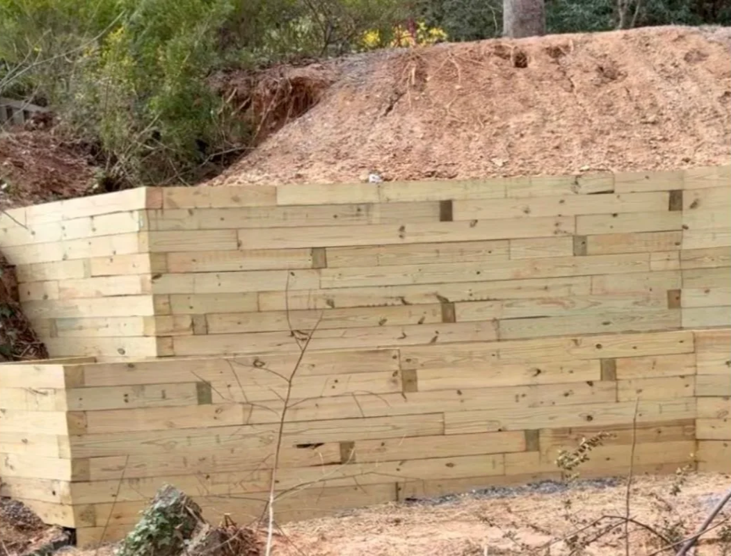 Large, double retaining wall for a residential landscape—service completed by Greenspan Landscaping Company in Black Mountain, NC.