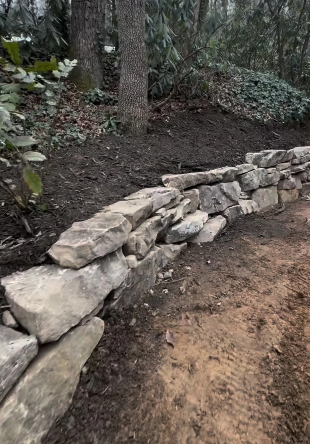Case Study: Boulder Retaining Wall + Steps in Black Mountain, NC (Storm Damage Repair)