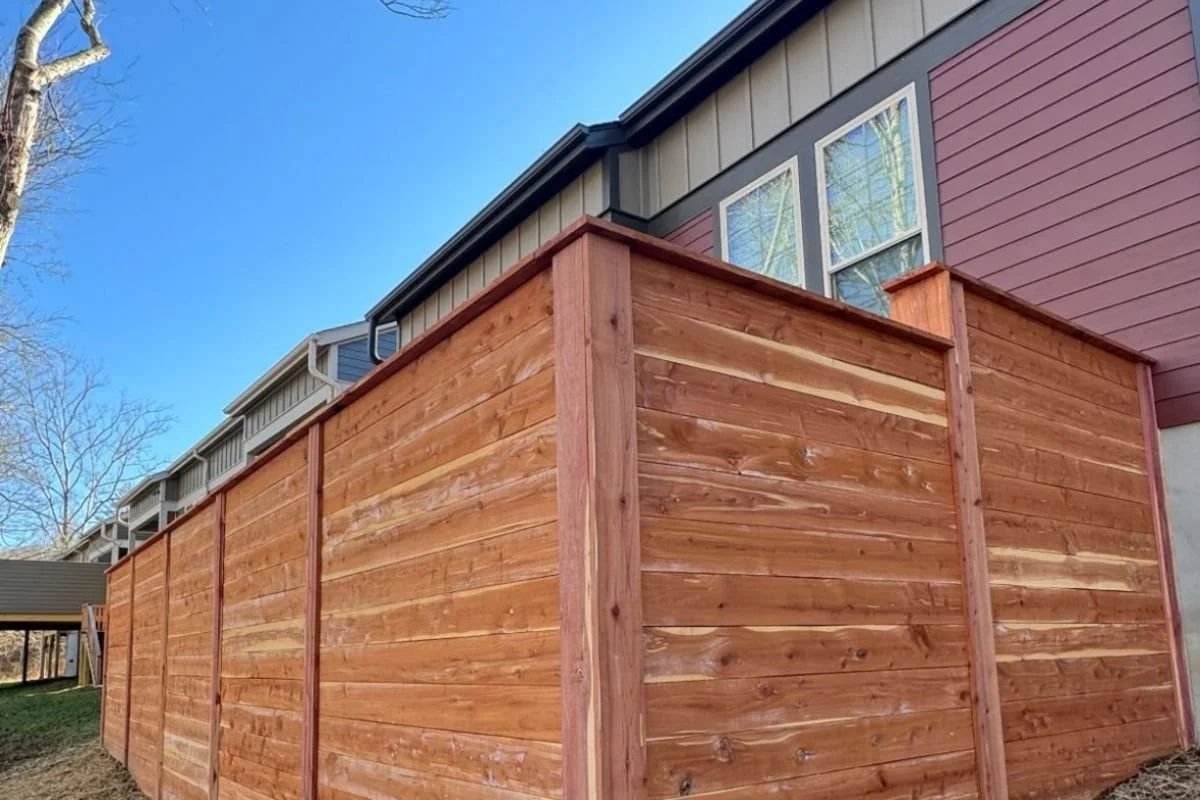 Horizontal cedar privacy fence installation at a residential property in Swannanoa, North Carolina.