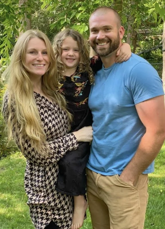 Family-owned landscaping business owners of Greenspan Landscaping Company in Black Mountain, NC standing together outdoors