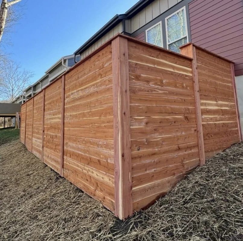 Custom timber privacy fence installation for backyard property boundary by Greenspan Landscaping Company in Fairview, NC