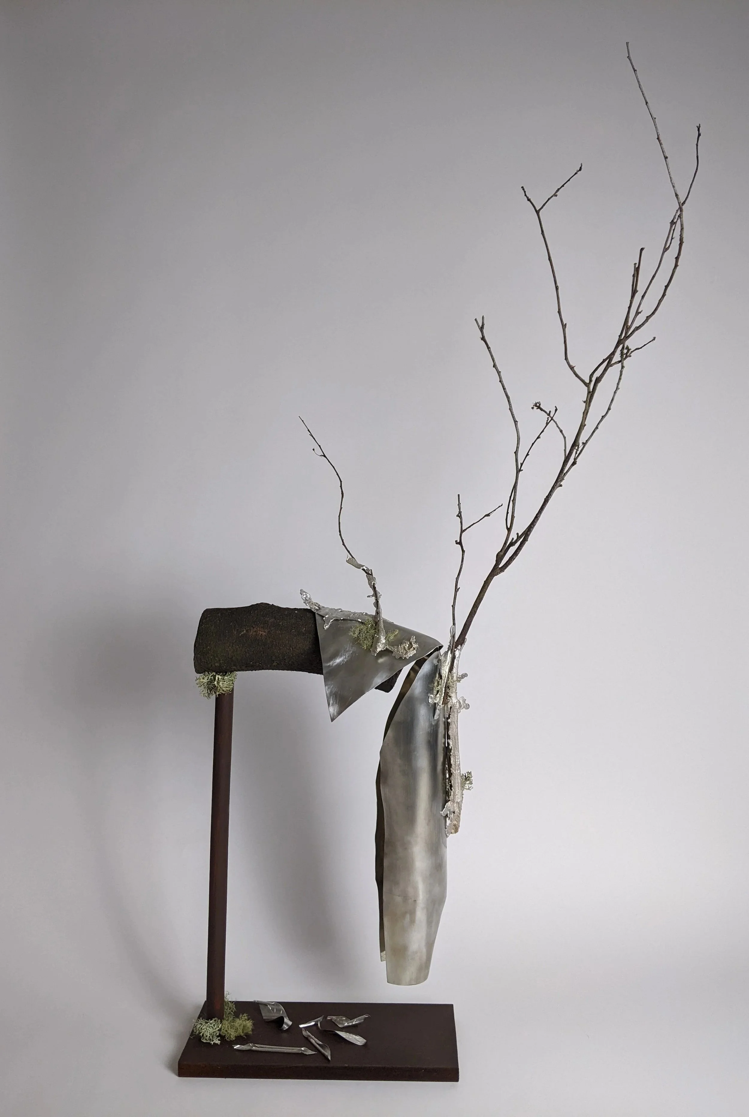 'Tree of Life' body sculpture, 2022. Pewter sheet, pewter shim, branches.