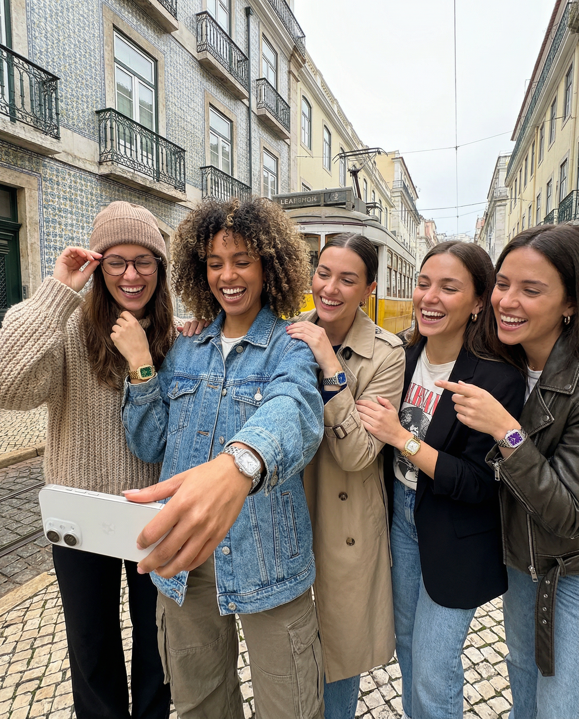 S17104L - showing the wrist in unique poses using lisbon city as a background. a group of female frends of diverse background and size. Only 1 watch per wrist but you choose between 2.png
