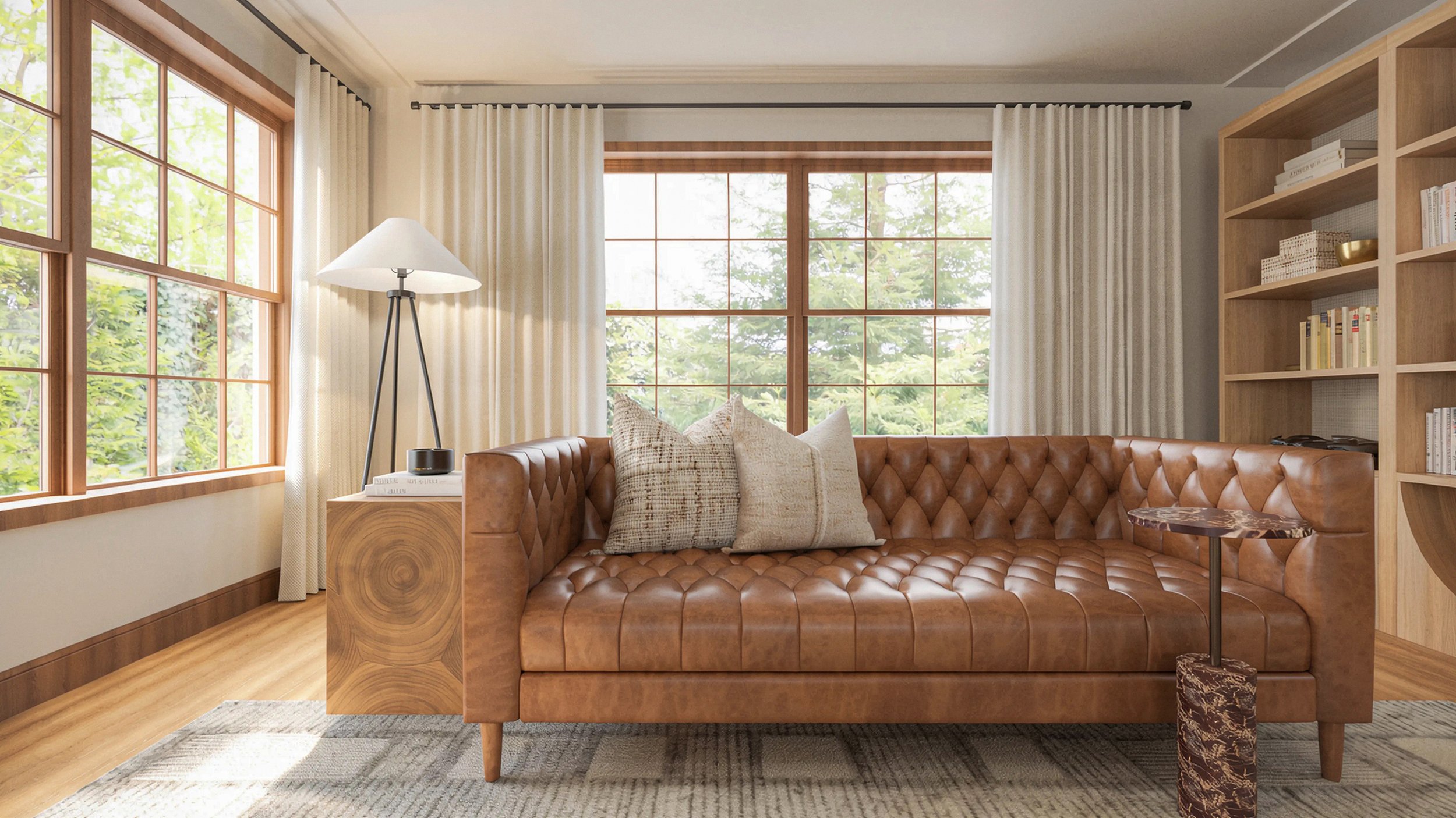 tufted leather sofa adding a library feel to the design paired with a modern teak end table and a simple iron tripod floor lamp