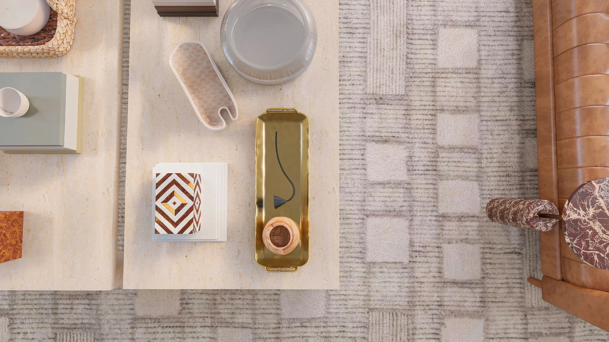 coffee table styling detail featuring a brass tray, inlay storage box, and other personal touches