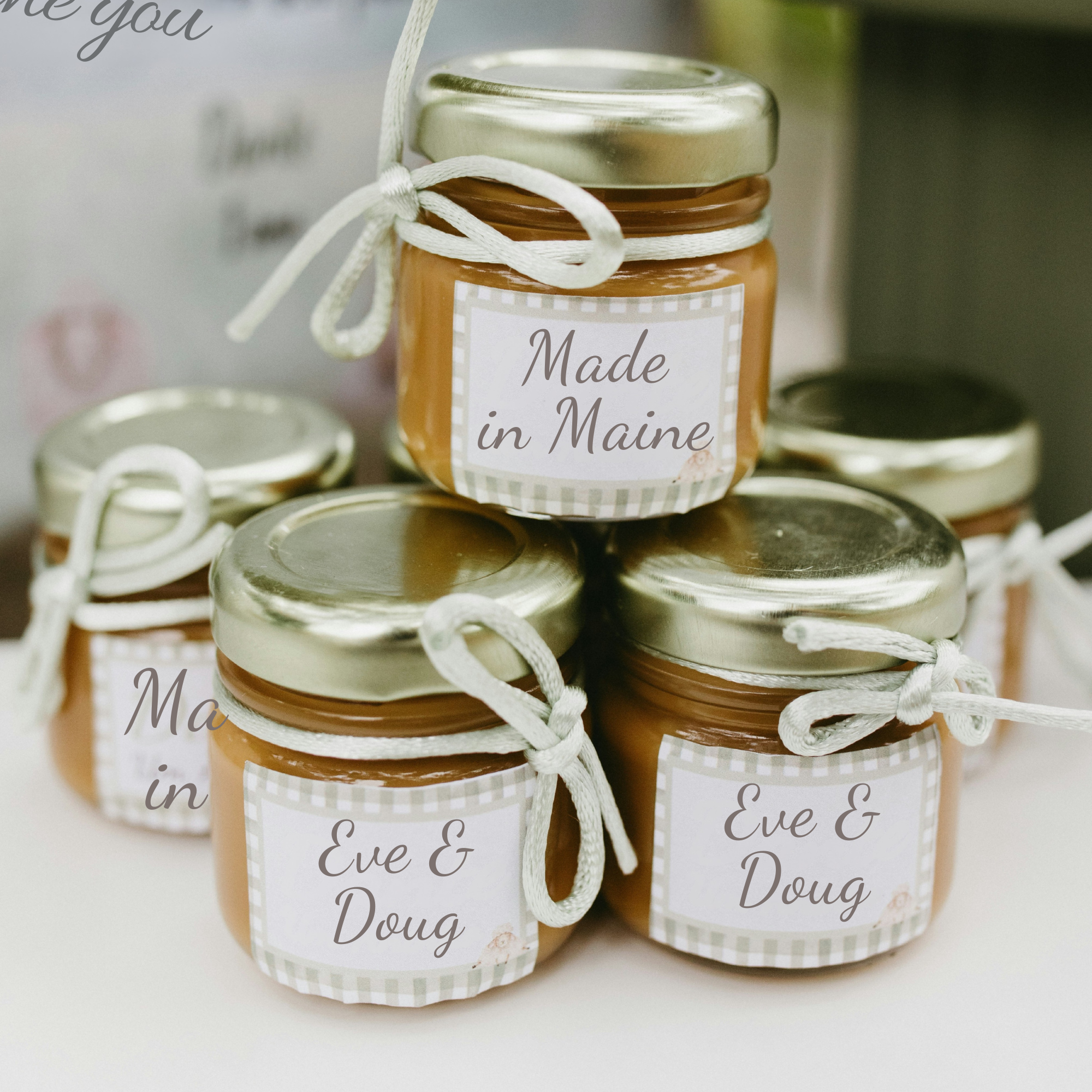  Assorted savory favor jars styled for reception table display.   