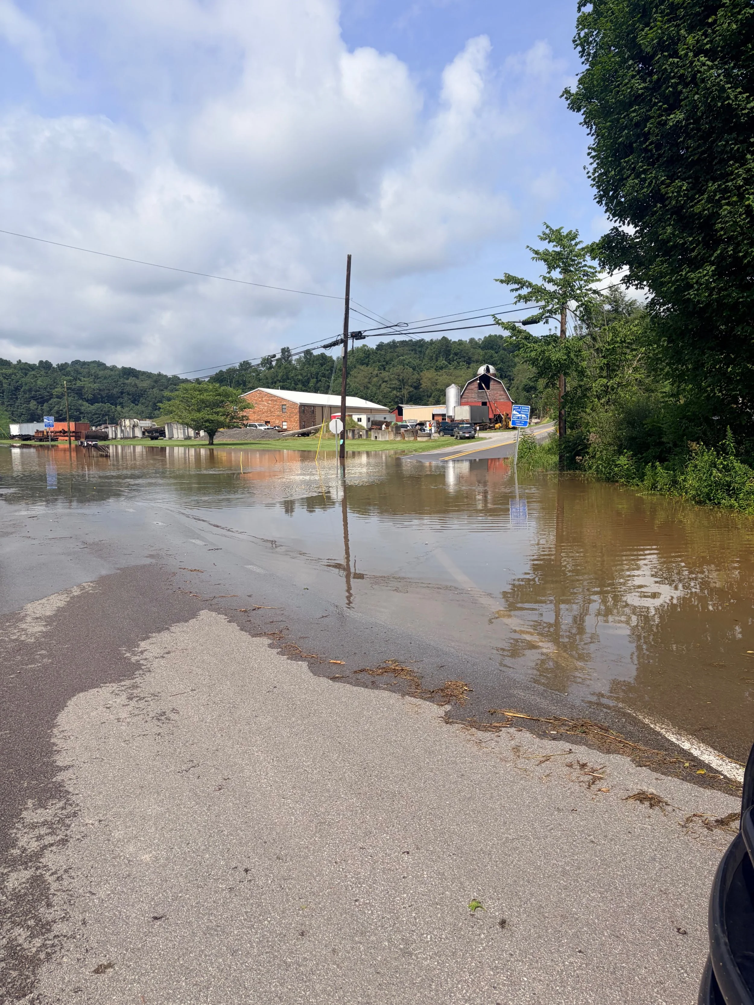 West Virginia Historic Flooding Triggers Statewide Emergency with 911 Outages and Over 100 Water Rescues