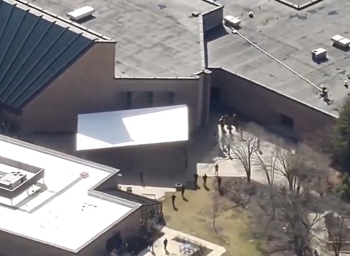 Aerial view of law enforcement response at a building targeted in an Iran-directed terror operation, illustrating the elevated domestic threat to Jewish and Western communities analyzed in Semper Incolumem's strategic intelligence report