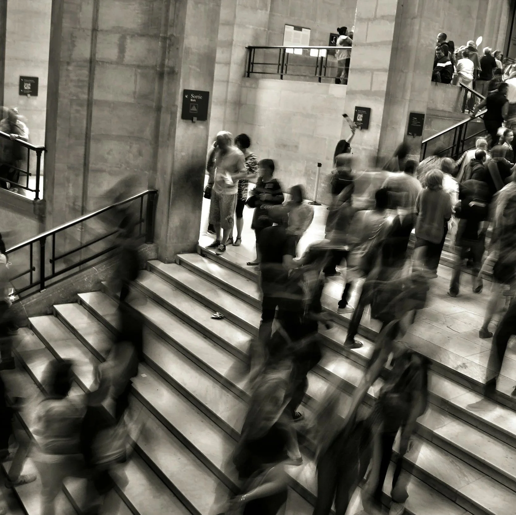 Busy public interior with moving crowd representing physical security intelligence for corporate security teams