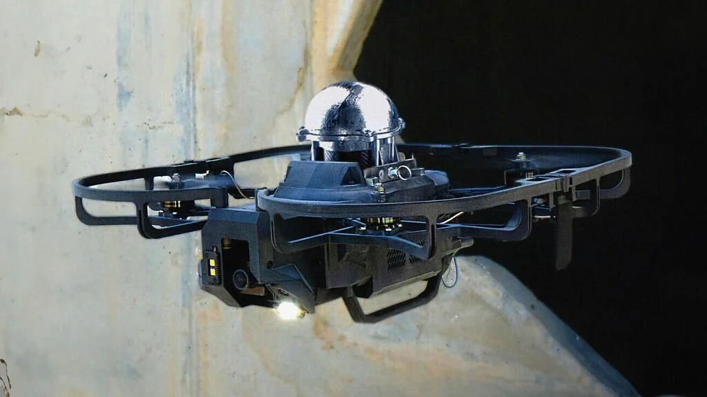 Quadcopter drone with a mounted device operating near a concrete structure