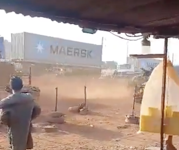 Ground-level footage of armed conflict near a shipping container in Mali during the JNIM offensive that exposed the failure of Russia's Africa Corps counterinsurgency model