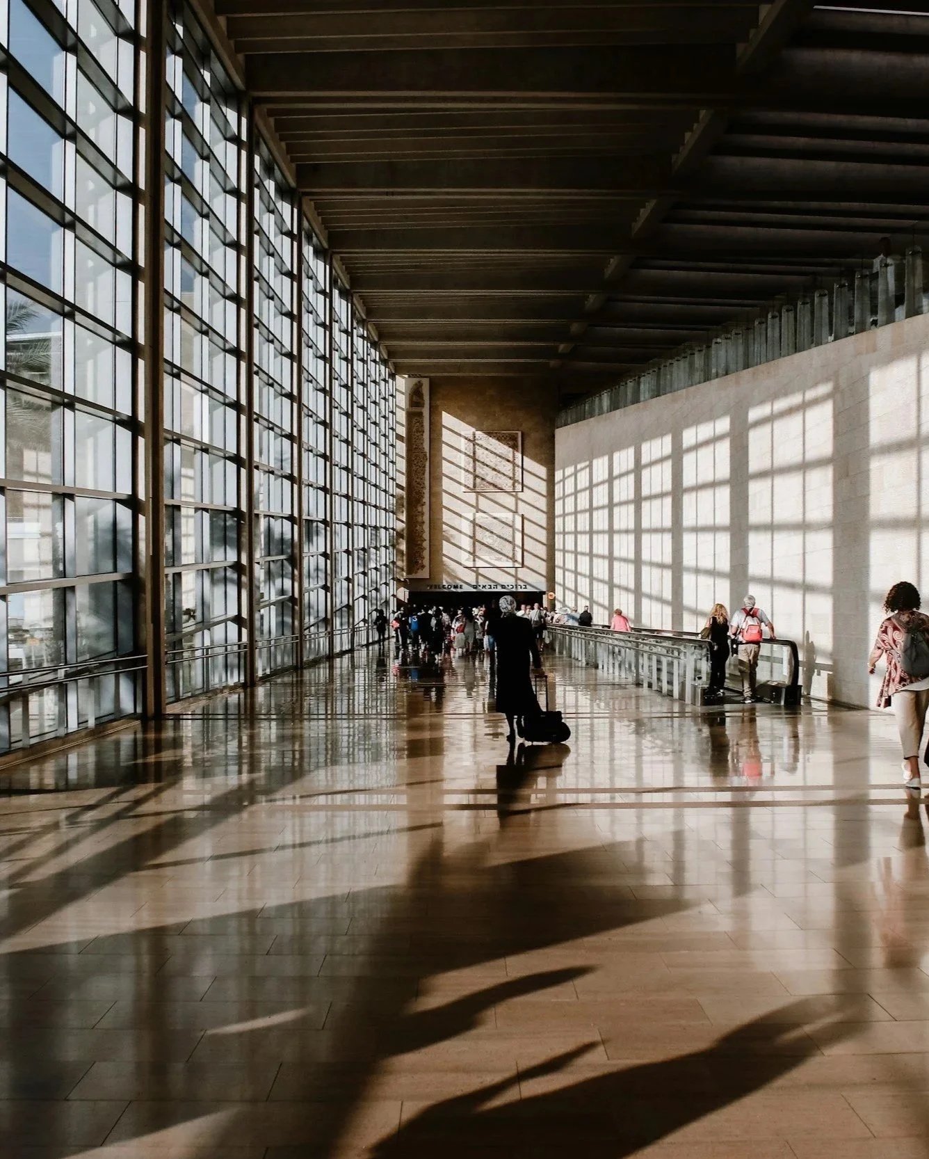 Busy airport terminal representing corporate travel