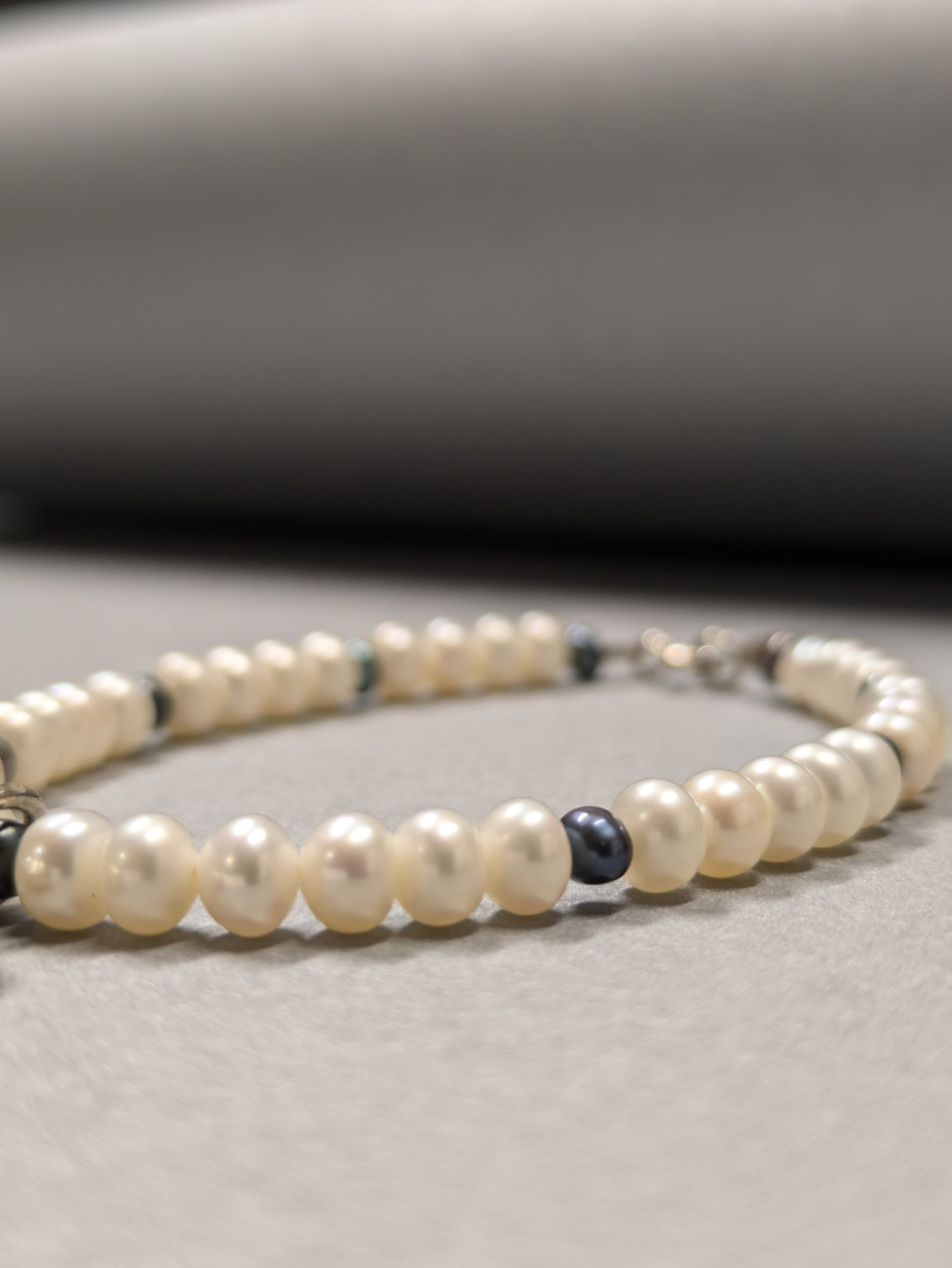 Sweet pearls and black tiny pearls with a silver Heart charm
