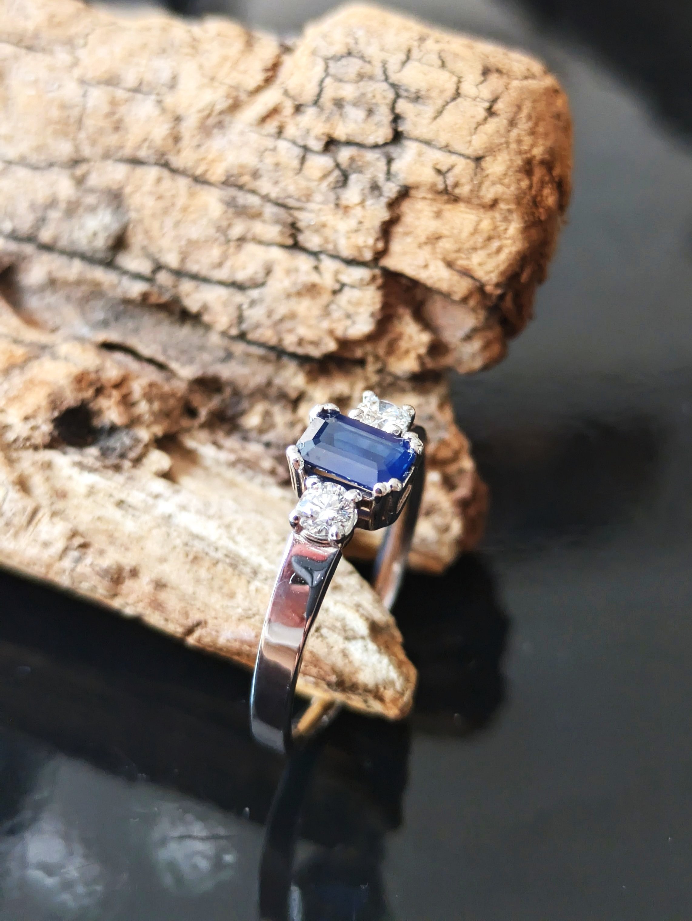 Trilogy Sapphire & Diamond Engagement Ring, side perspective on the Palo Santo display