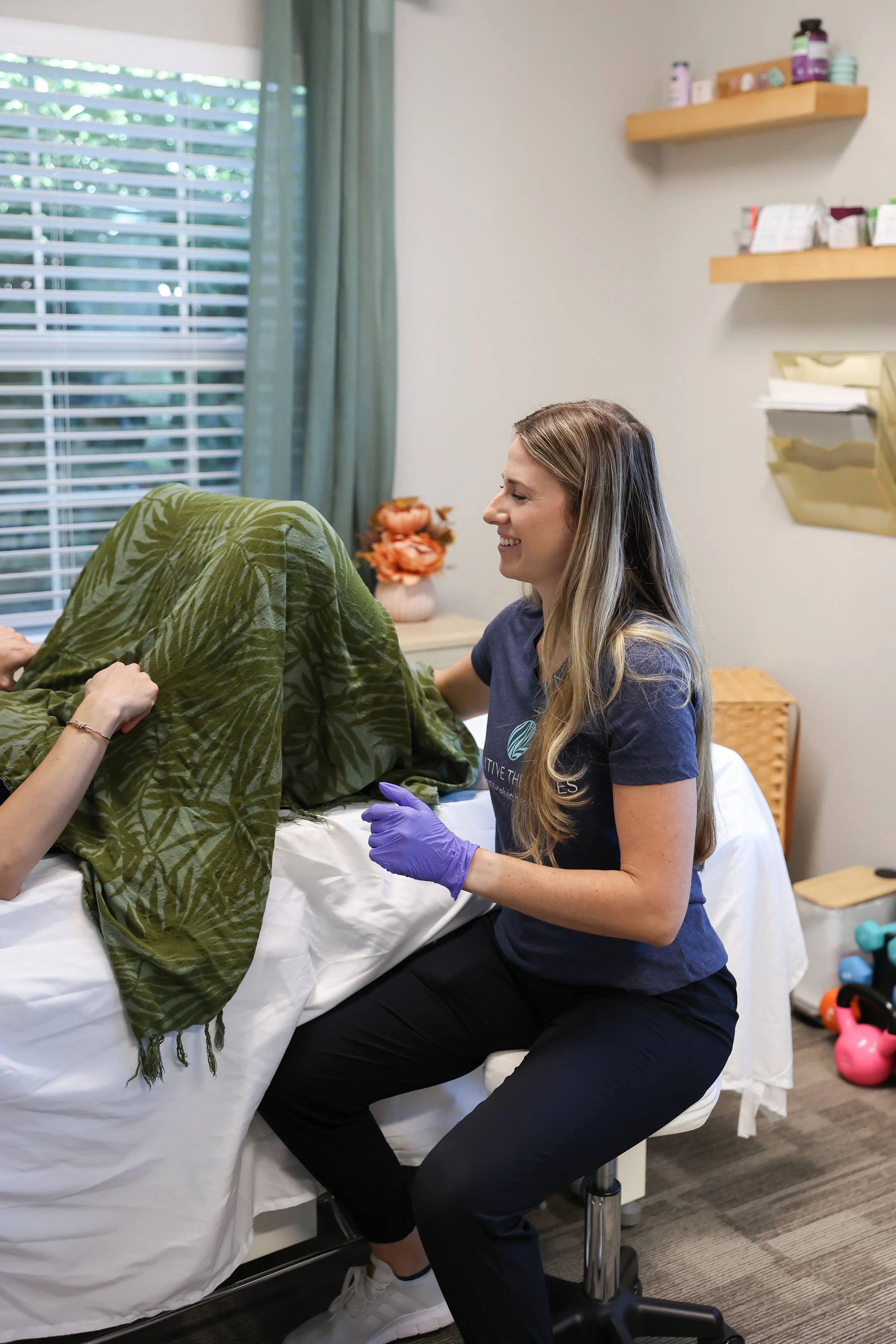 Abby Mandelblatt, PT, DPT with a client at a pelvic floor therapy practice in Tampa, FL