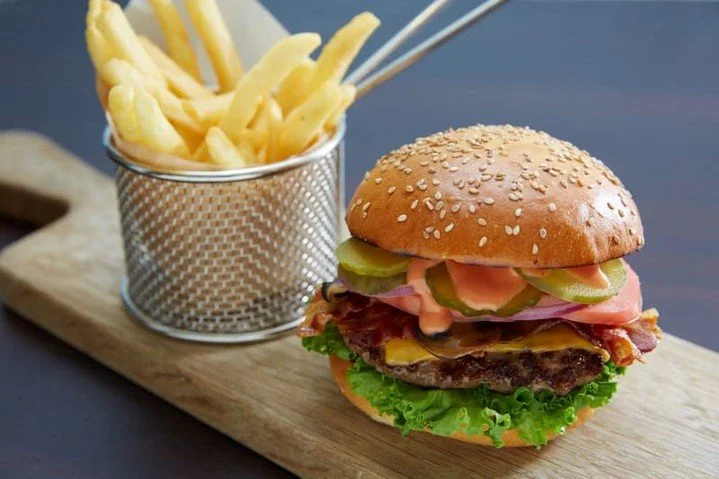 🍔 Sea day cravings? Mast Grill has you covered. ☀️ 
Whether you're taking a break from the pool or grabbing a quick bite between activities, Mast Grill serves up casual favorites that hit the spot. Fresh off the grill, full of flavor, and paired wit