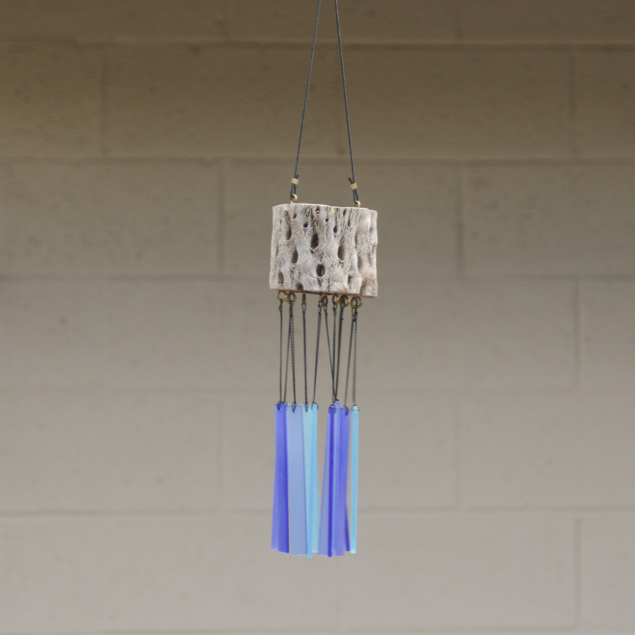 Windchime crafted with cholla cactus and blue hued glass