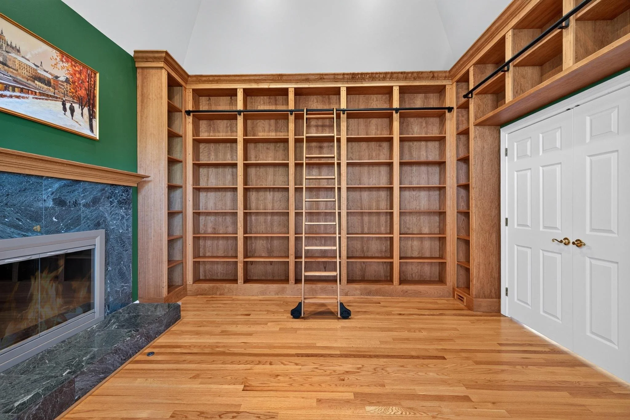 Cherry wood library bookcases with rolling ladder in Clarence, NY.