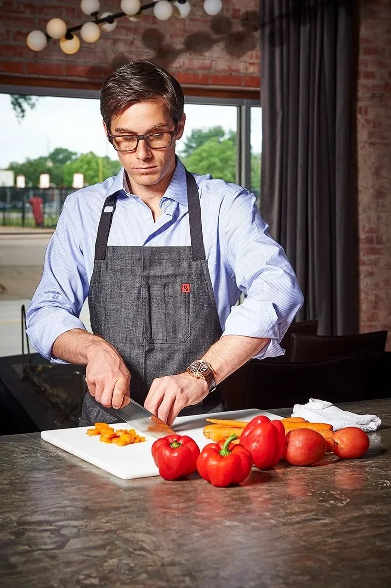 Paul Petronella cutting veg for Tiffany's watch campaign. Photo by Fulton Davenport.
