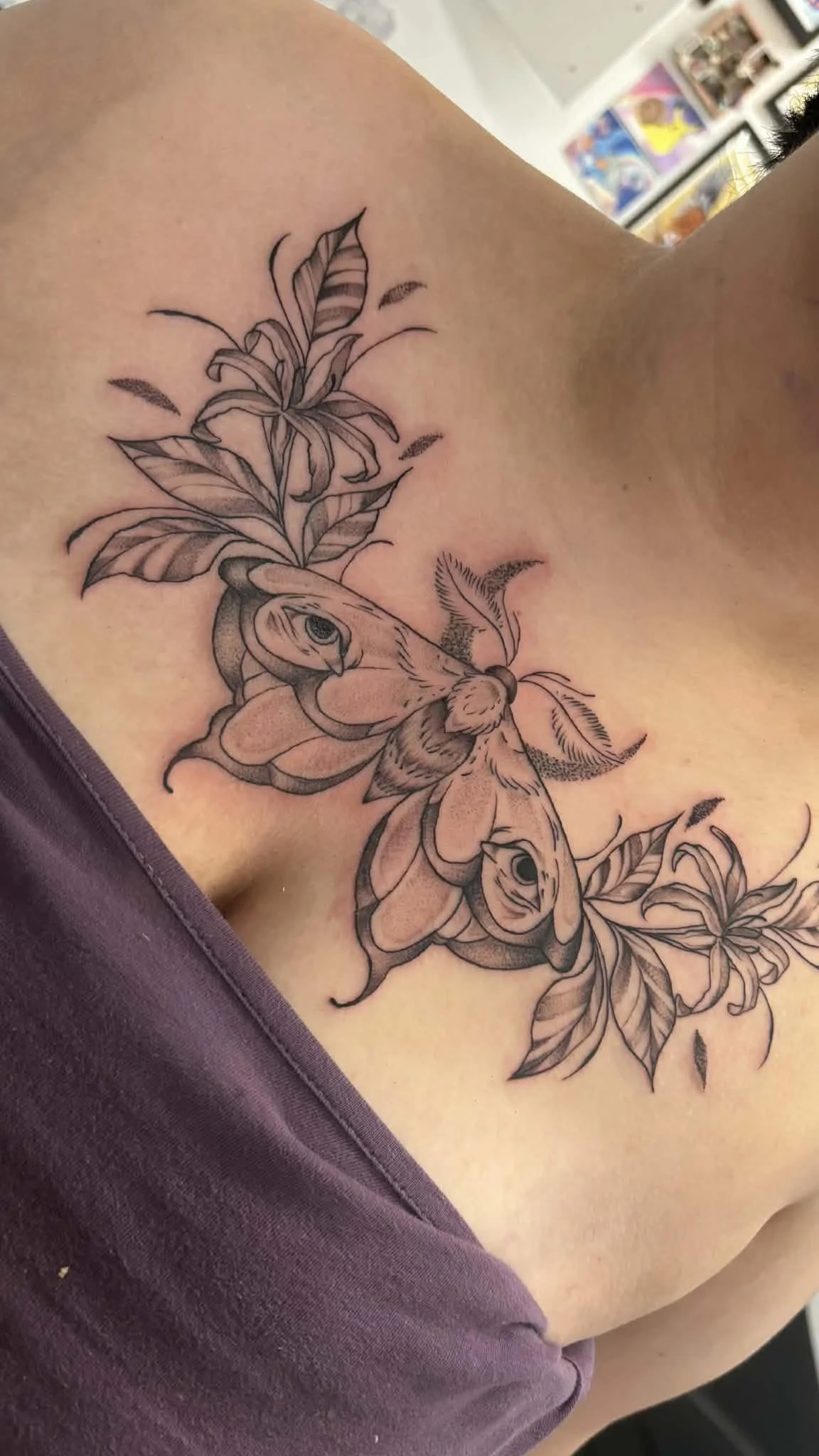 chest tattoo with a moth by Bella Saskatoon tattoo studio tantrix body art