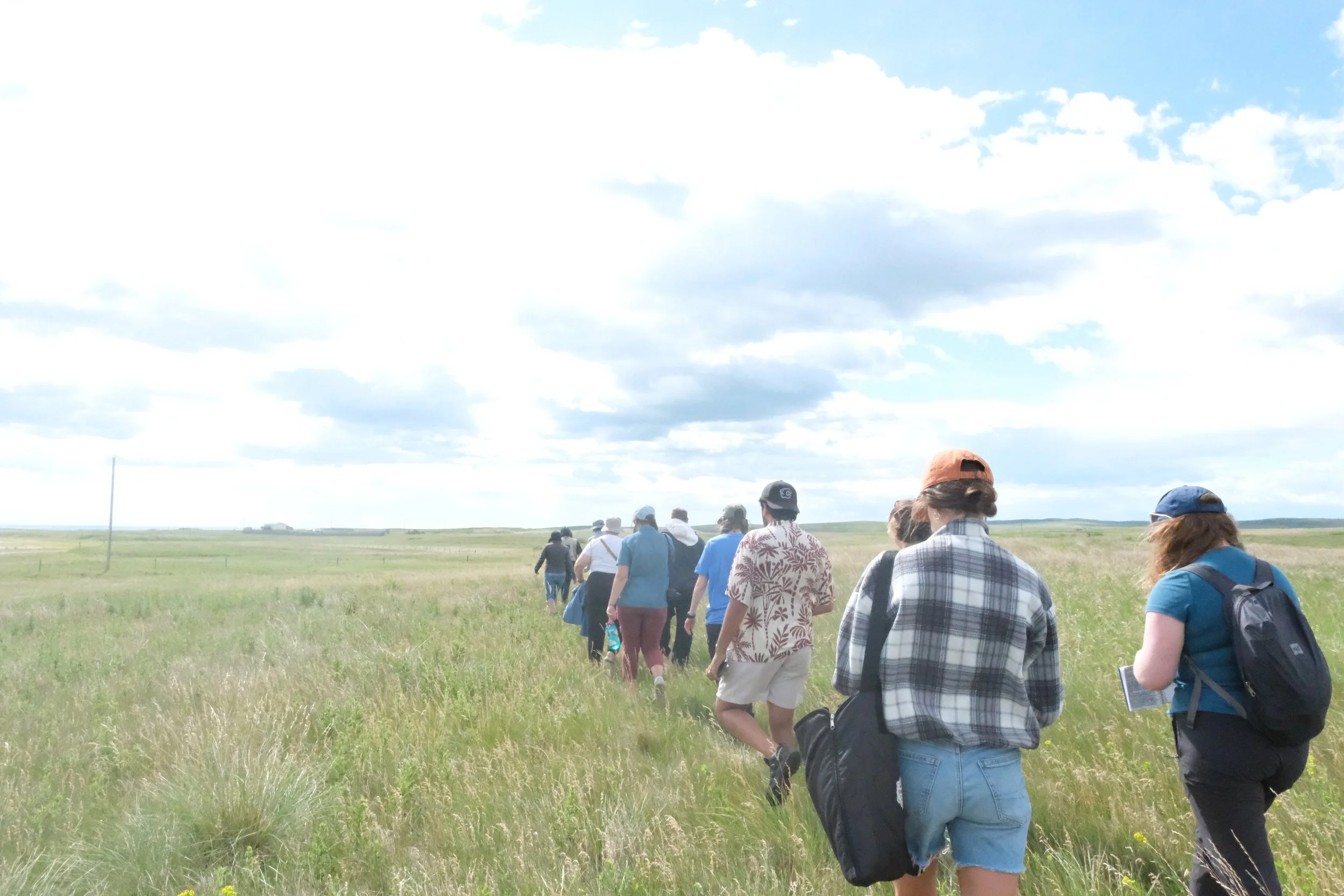 Learning from Api'soomaahka at Naapi's Garden. Photographed by Meeka and Ani.