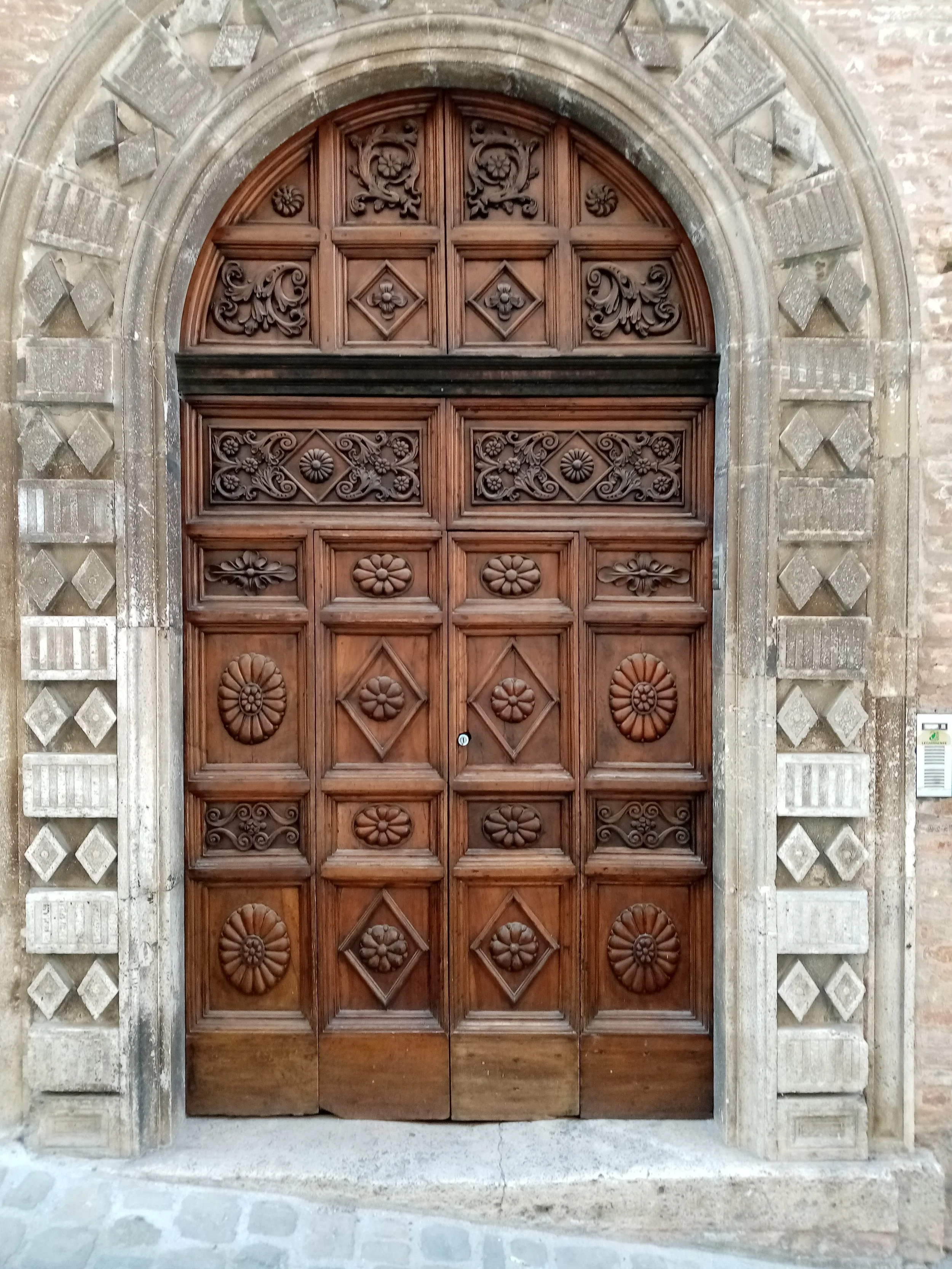 Door carved by Marcolini in the early 1900s. Amandola's historic centre