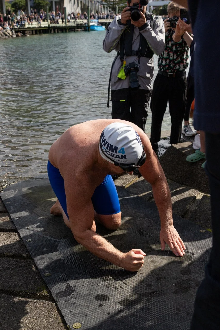 Swim4TheOcean: Jono Ridler at Wellington’s waterfront, 4 April 2026, photographed by Ben Maurice.