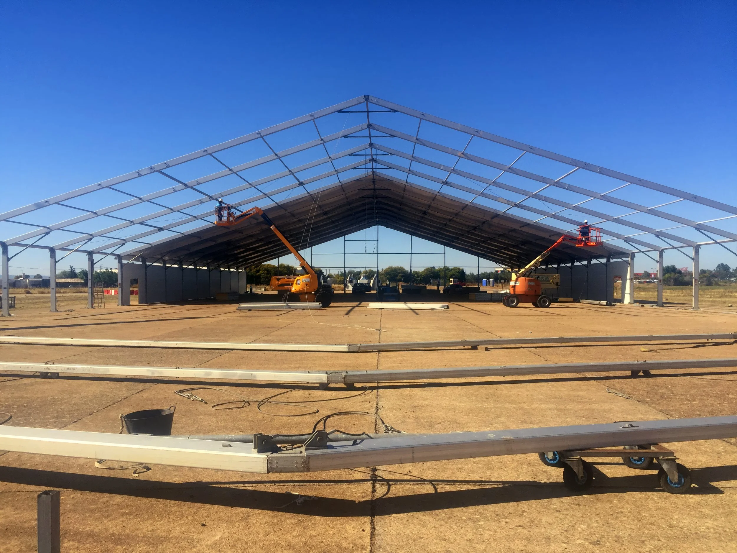 3000 square foot plane hanger production at sevilla airport for a sustainable corporate event. 