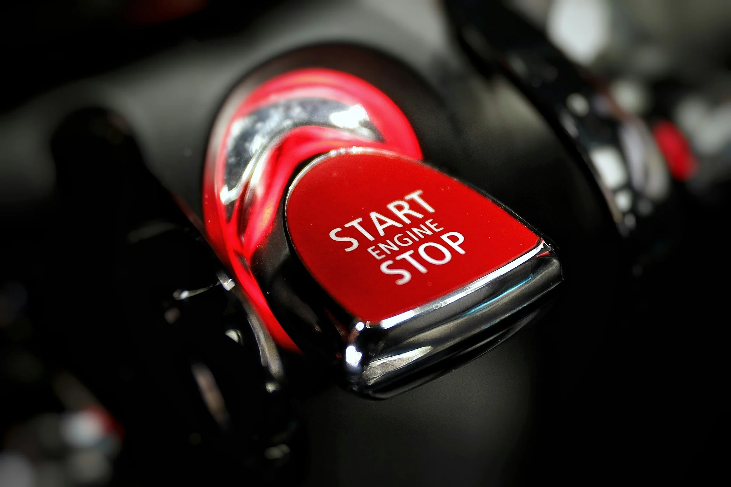 Engine start button representing automotive PR