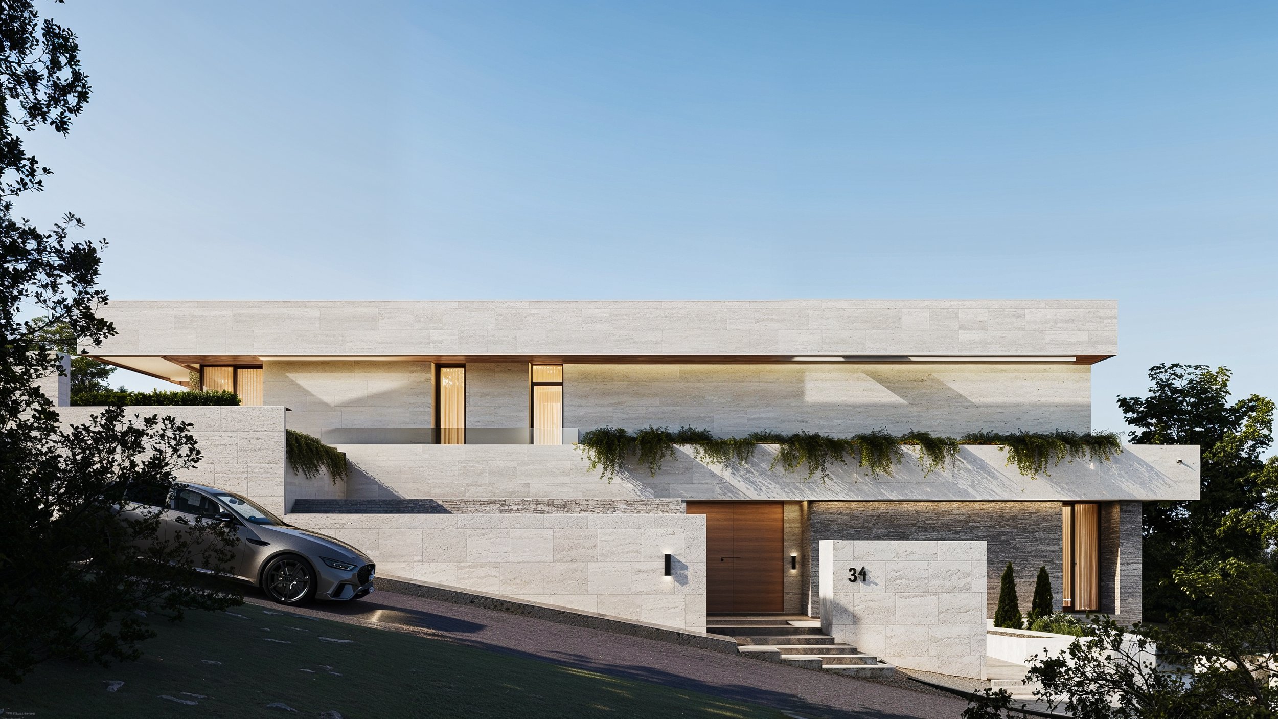 Modern multi-story house with a flat roof, large windows, and a mix of stone and wood exterior, surrounded by trees and a driveway with a parked car.