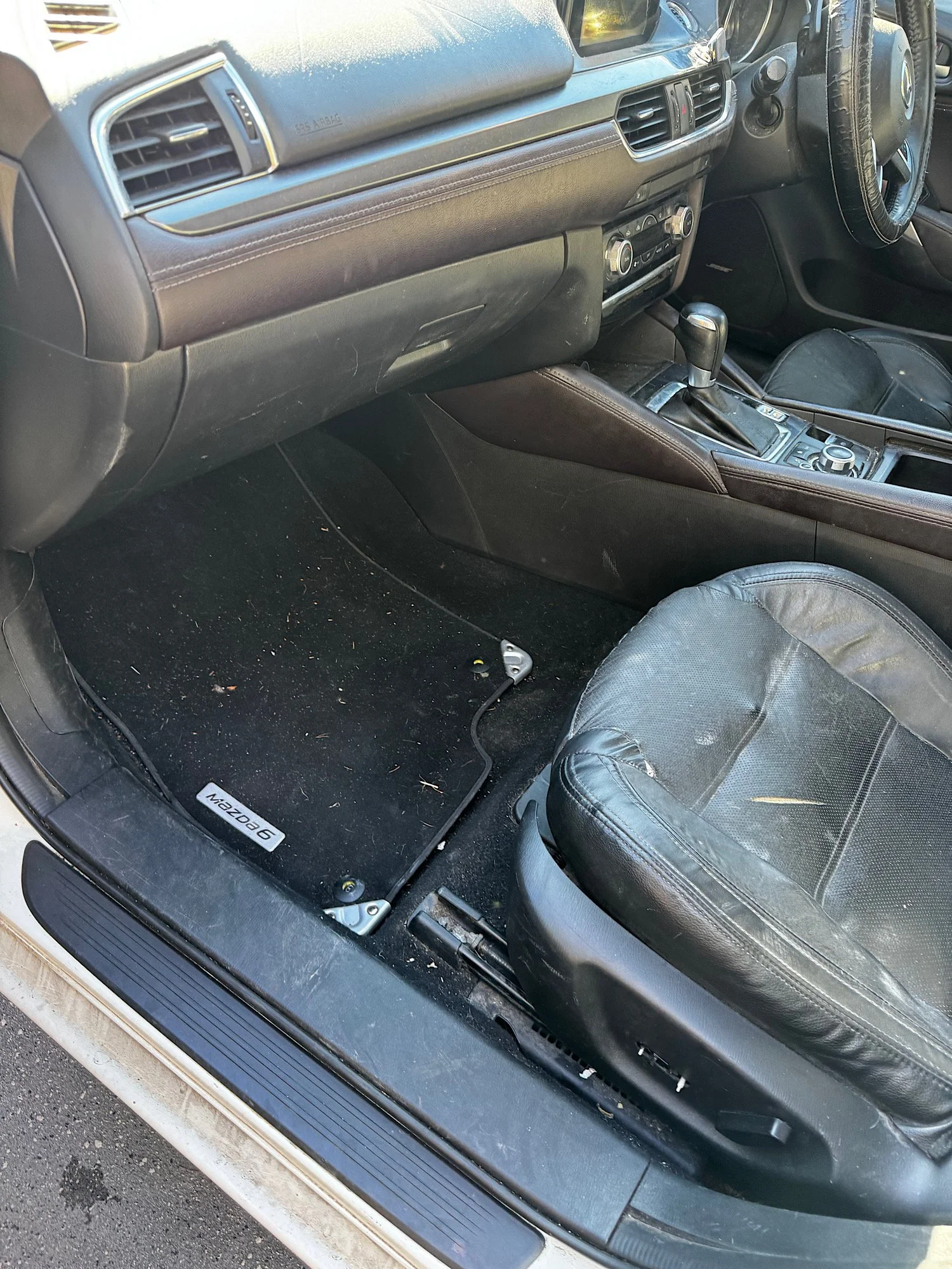 Mazda 6 interior condition before detailing showing dust and wear