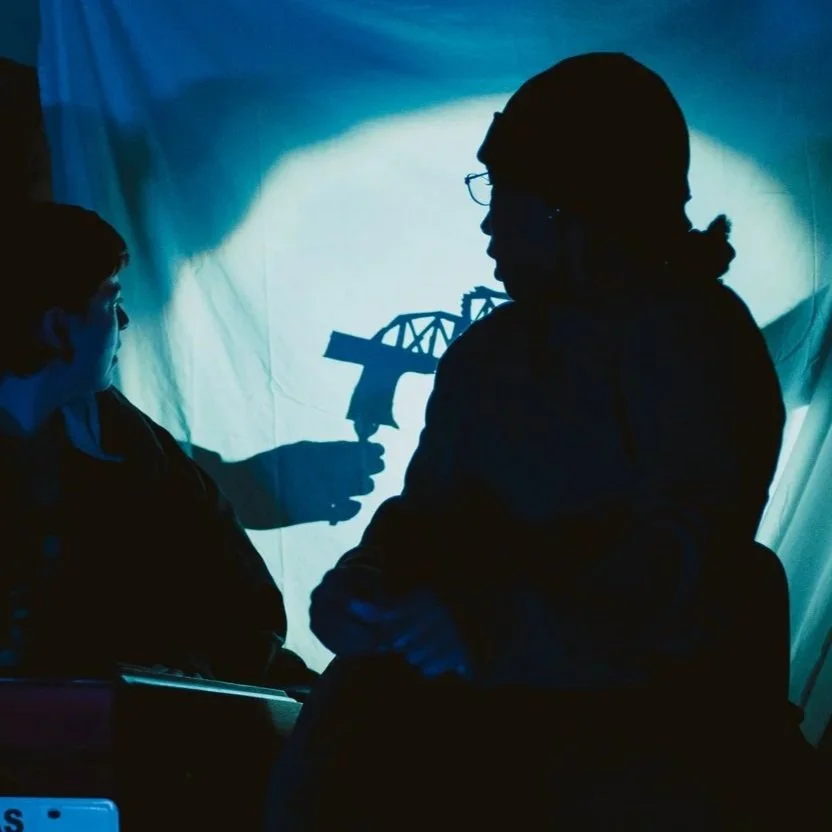 are you listening? The Makers Ensemble: broken bridge shadow puppet, poster board, plastic fork