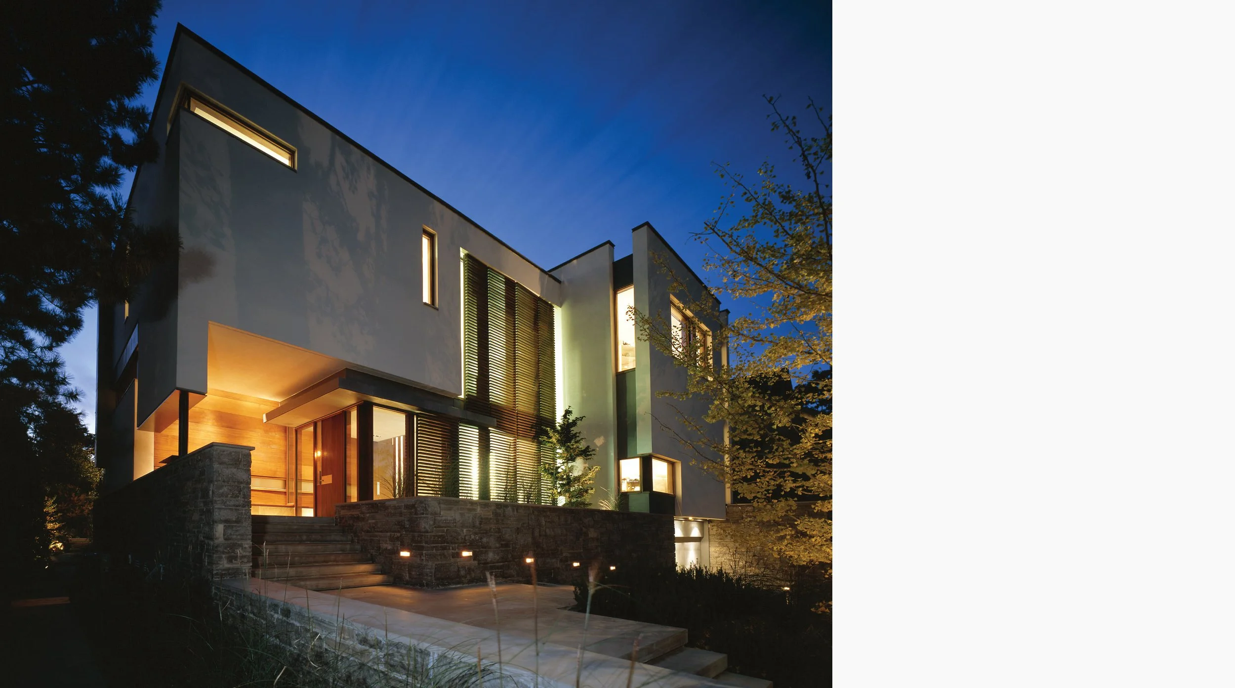 Modern house with stucco and wood screen facade