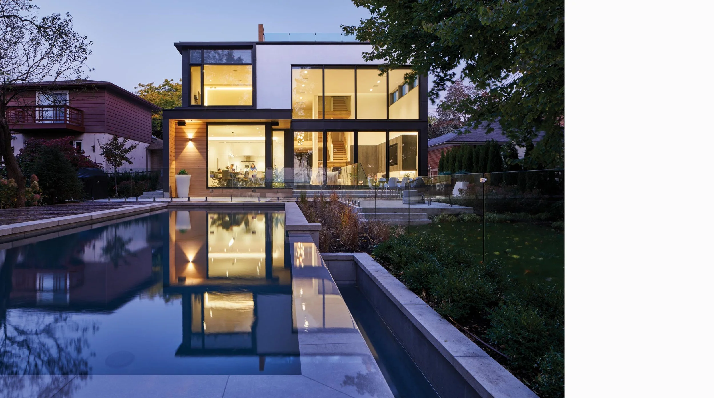 Rear elevation of Fishleigh Drive Residence with a patio and pool.