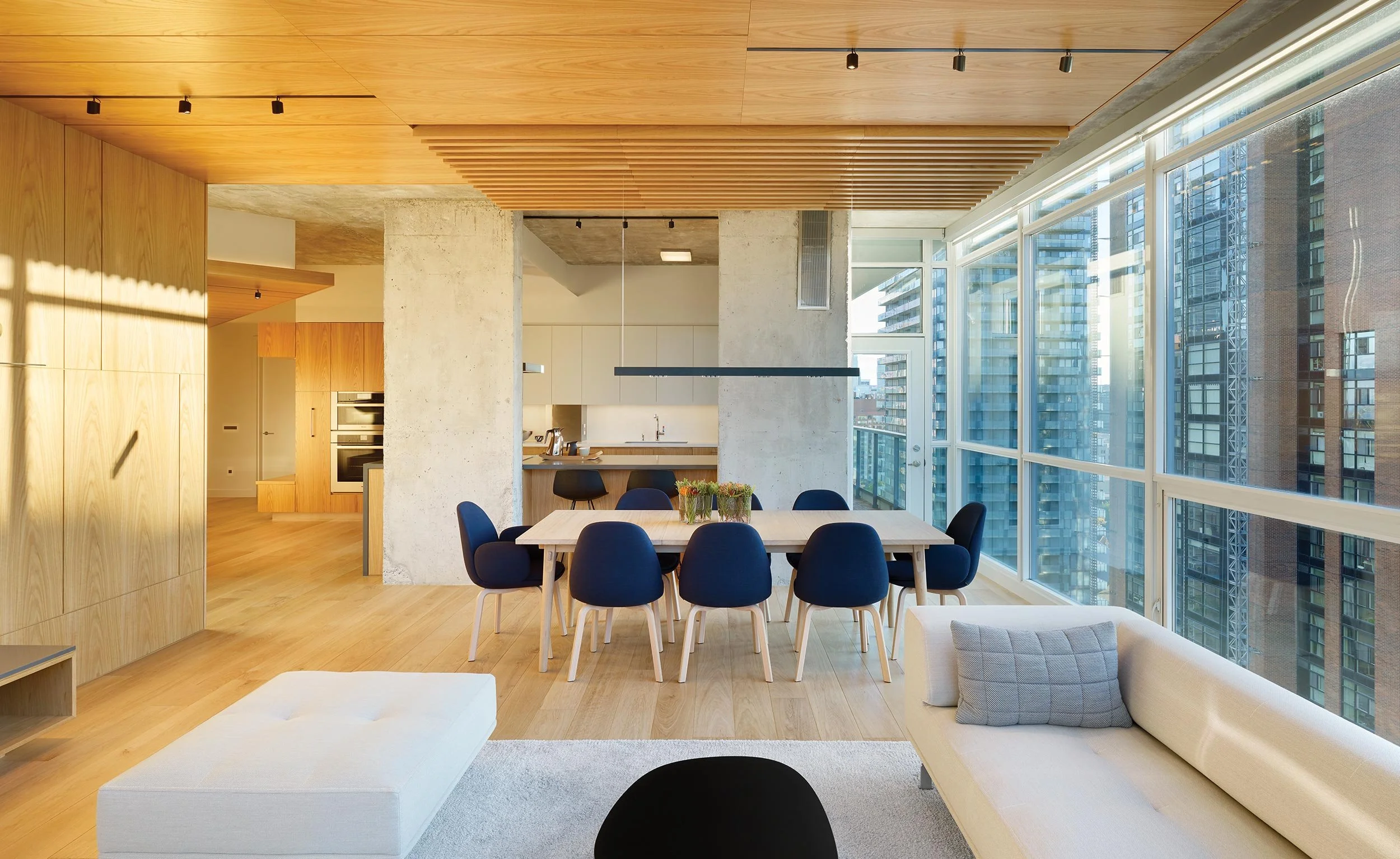 Bay Street Condo kitchen with exposed concrete and wood ceiling