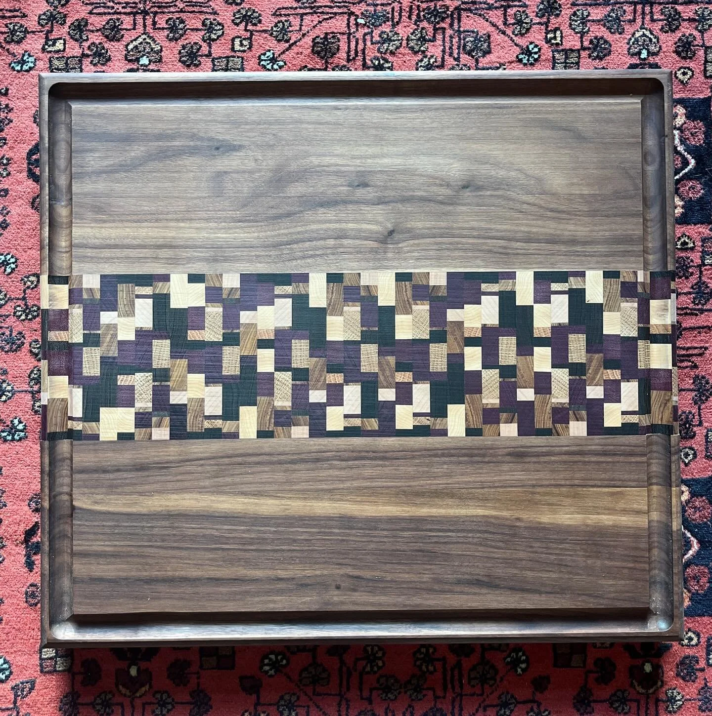 This board is one of my top favorites to make!  This one was massive, over 1 and a half inches thick and over 20 inches long.  The top and bottom half are walnut and the middle portion is maple, post oak, purple heart, peruvian walnut, canary and wen