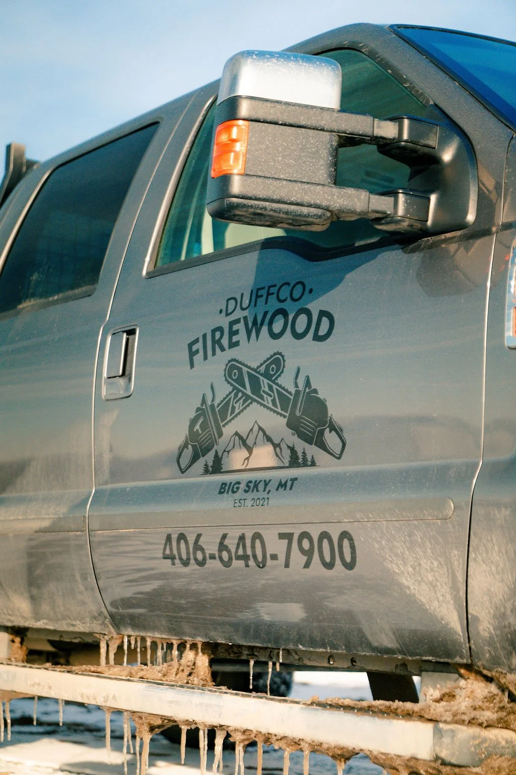 Duffco Firewood branded, silver truck door.