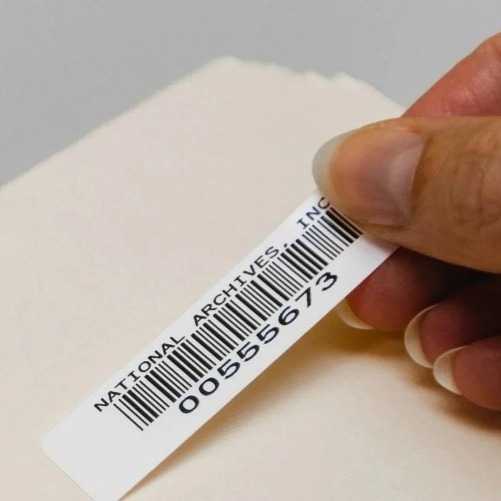 File being barcoded for secure document tracking and records management