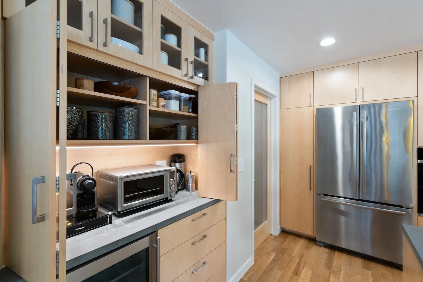 Flat Panel Bifold Doors Open to Reveal Wide Hidden Appliance Garage and Dry Goods Pantry.jpeg