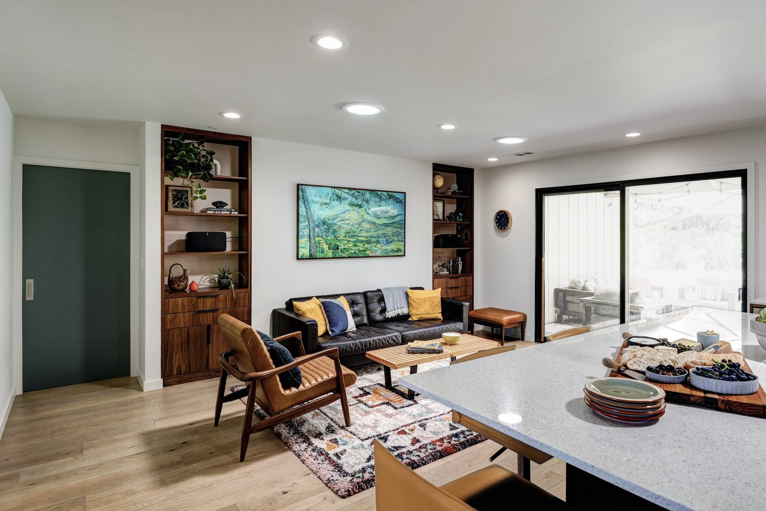 OPEN CLOSE BLUE POCKET DOOR MODERN WALNUT SHELVING .jpg