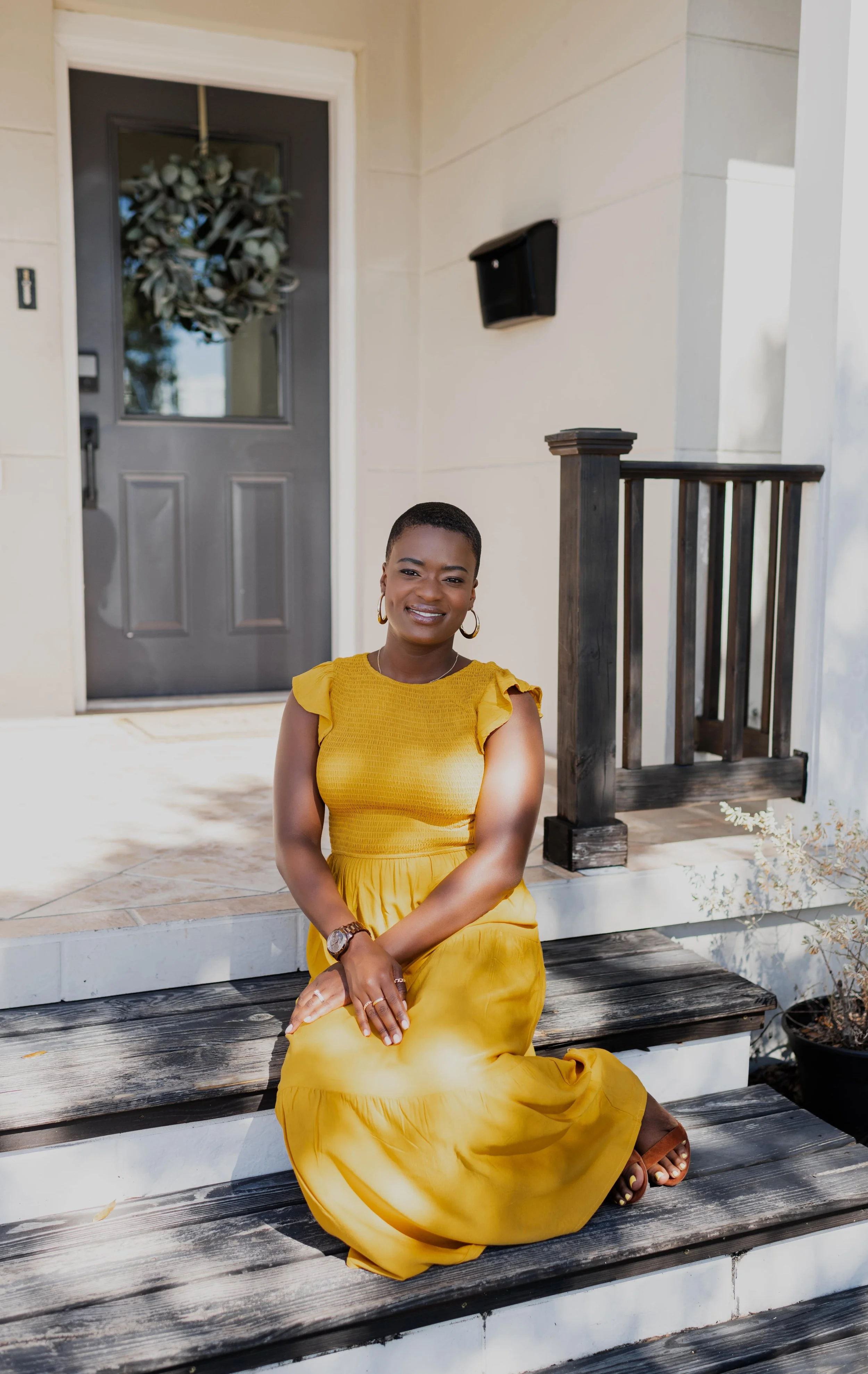 Bereavement doula Dee Larkin on porch in South Tampa, Florida.
