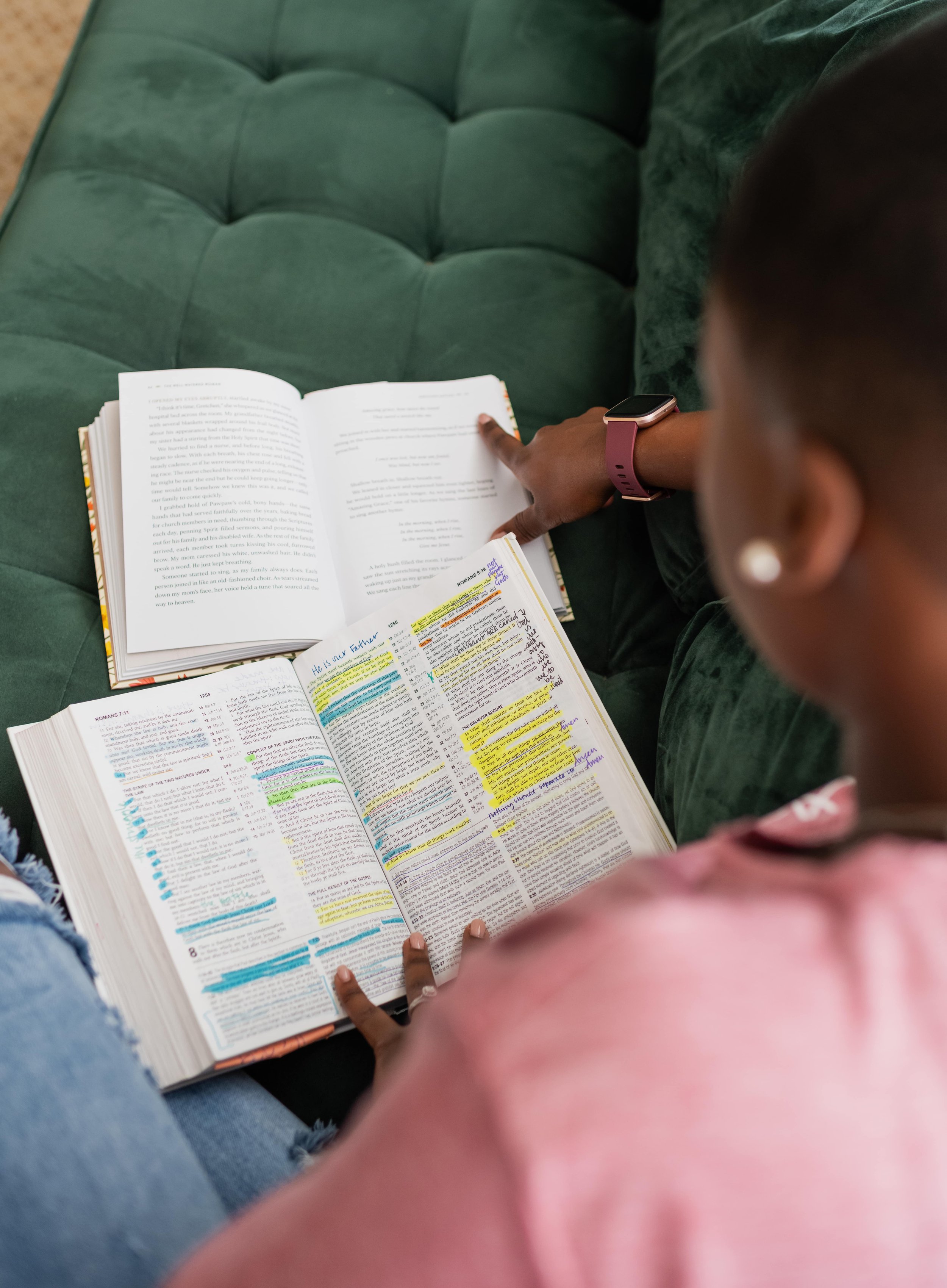 Doula Dee Larkin reading the bible on couch in Tampa Bay Area.