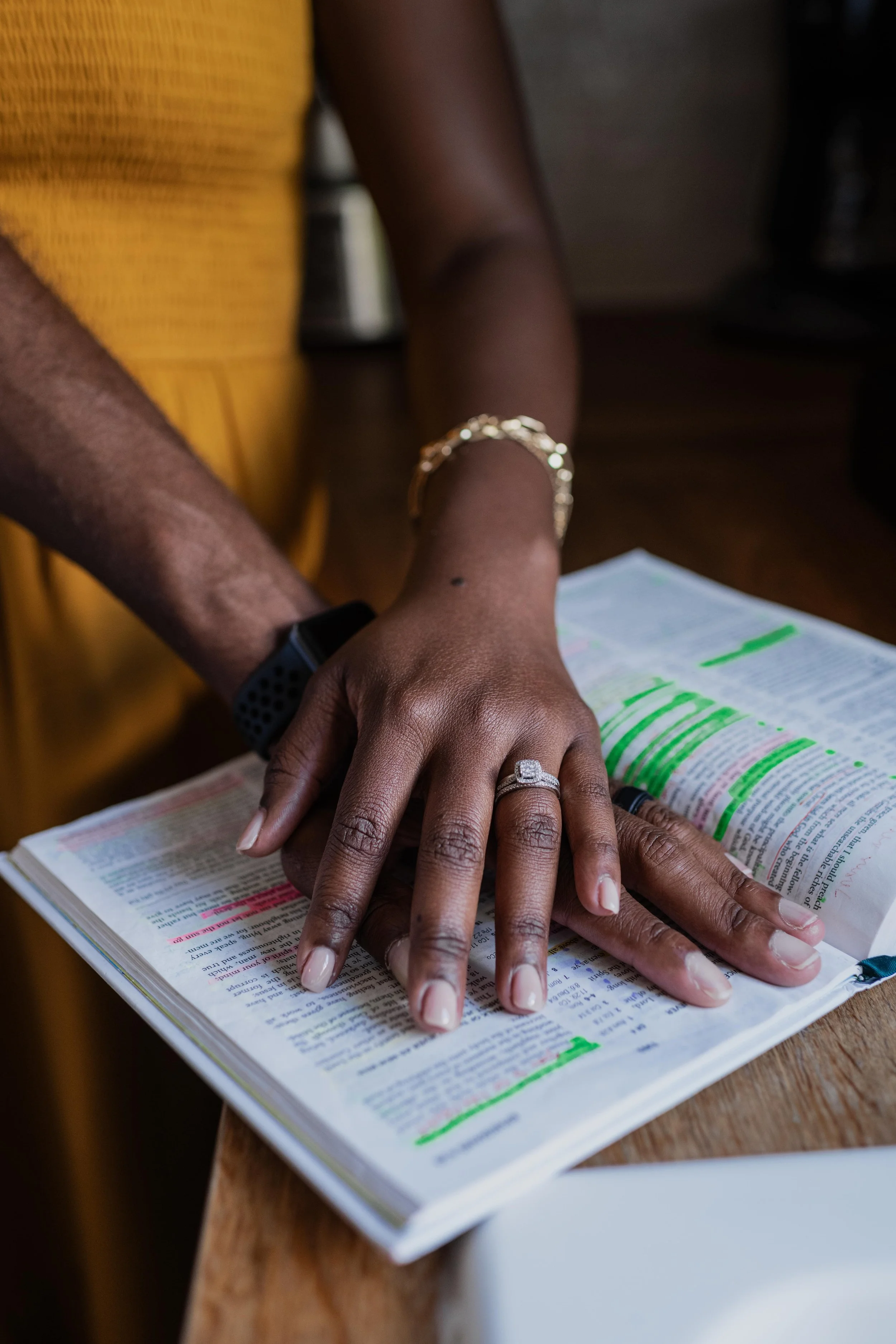 Praying hands on top Christian bible in Wesley Chapel, Florida.